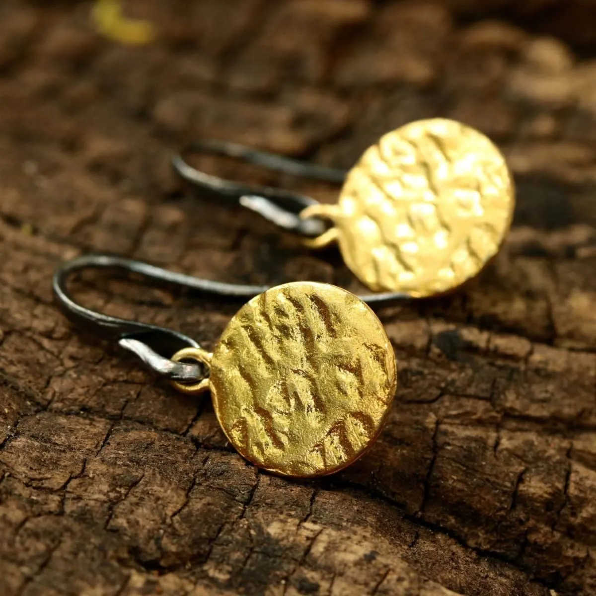 Gold plated brass discs earrings with texture and hangs on sterling silver oxidized hook