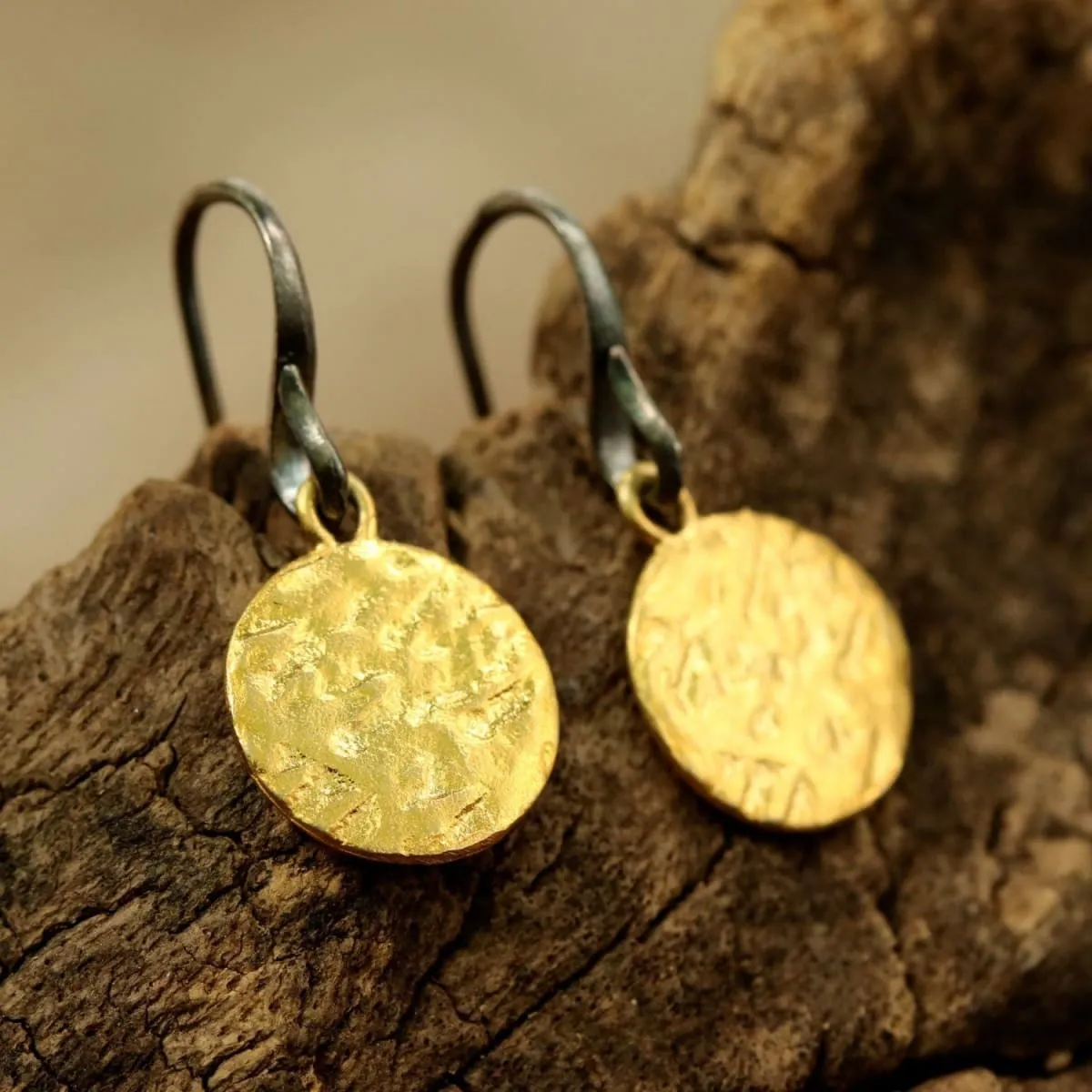 Gold plated brass discs earrings with texture and hangs on sterling silver oxidized hook